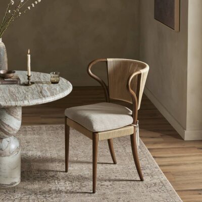 Elegant wooden chair in a modern, neutral-toned room.