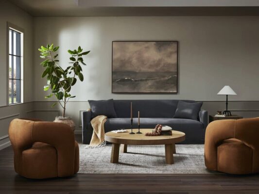 Modern living room with stylish furniture and artwork.