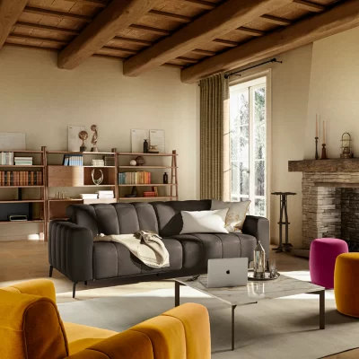 Natuzzi Portento sofa, in a grey color. In a warm and stylish living room.